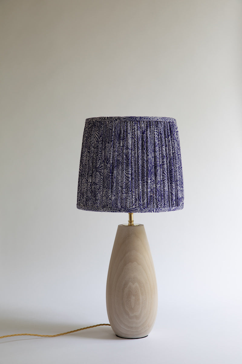 Gathered lampshade with stunning limed wood table lamp in teardrop shape